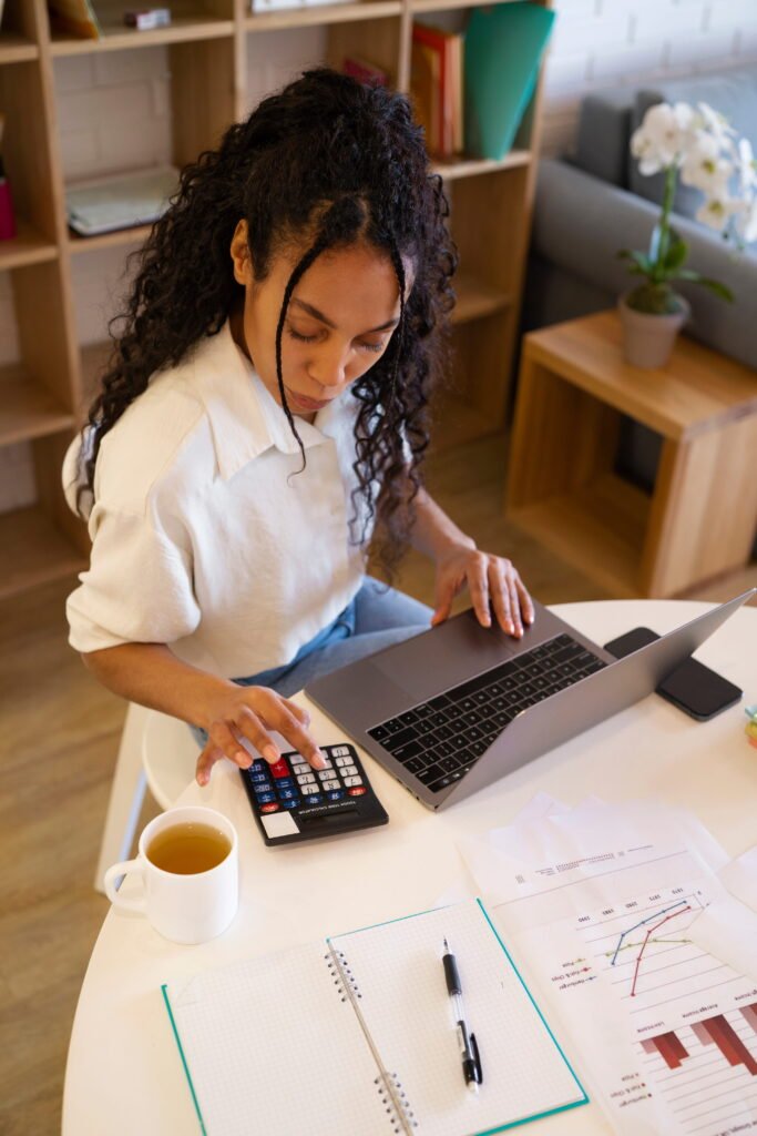high-angle-woman-working-laptop